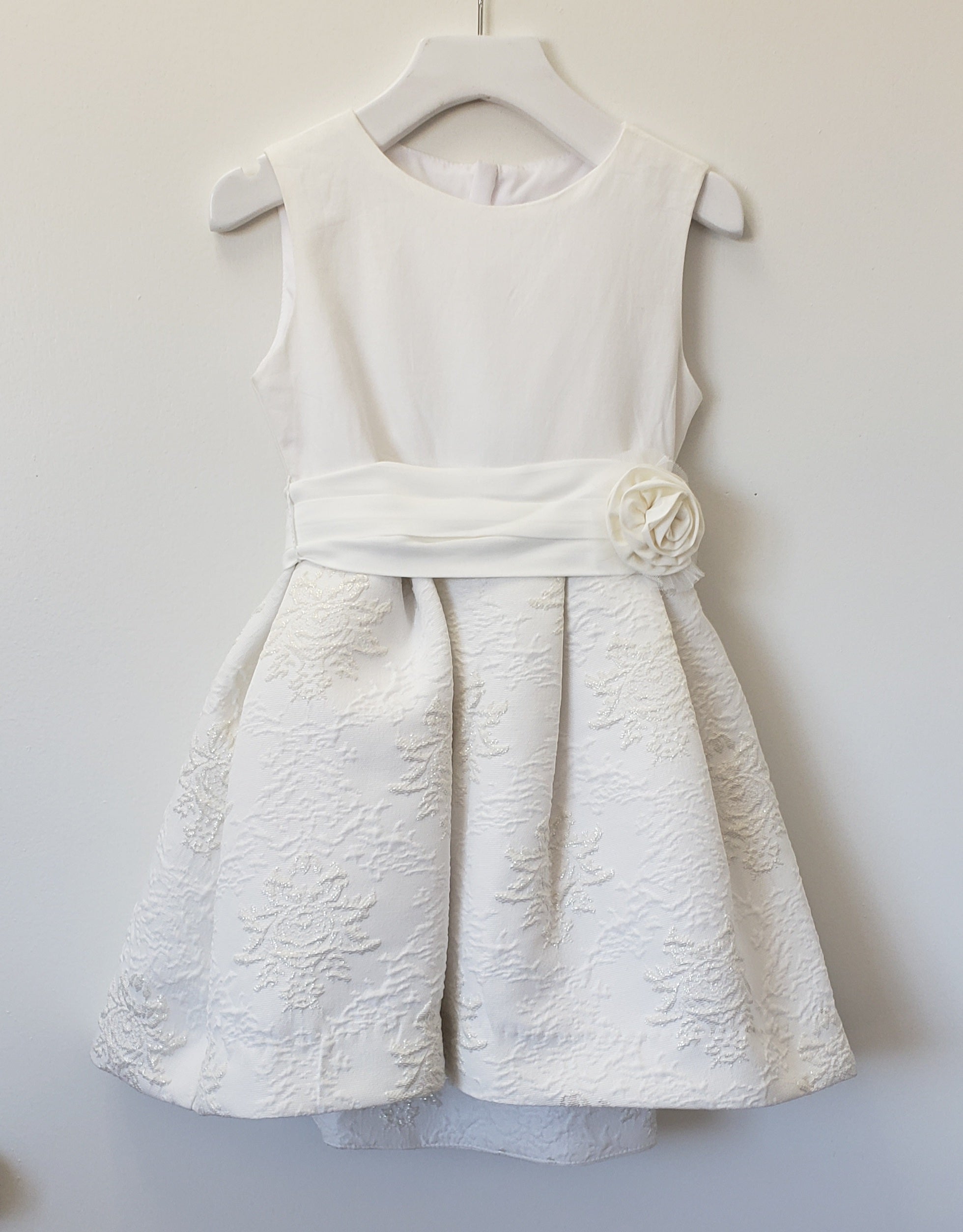 Sleeveless ivory rosette dress